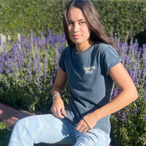 This stunning stone-washed ladies tee is made from 100% combed cotton, ultra-comfortable, hand-dyed, making each tee unique. It combines premium quality with environmental consciousness. Its design features include a curved hem and rolled sleeves.